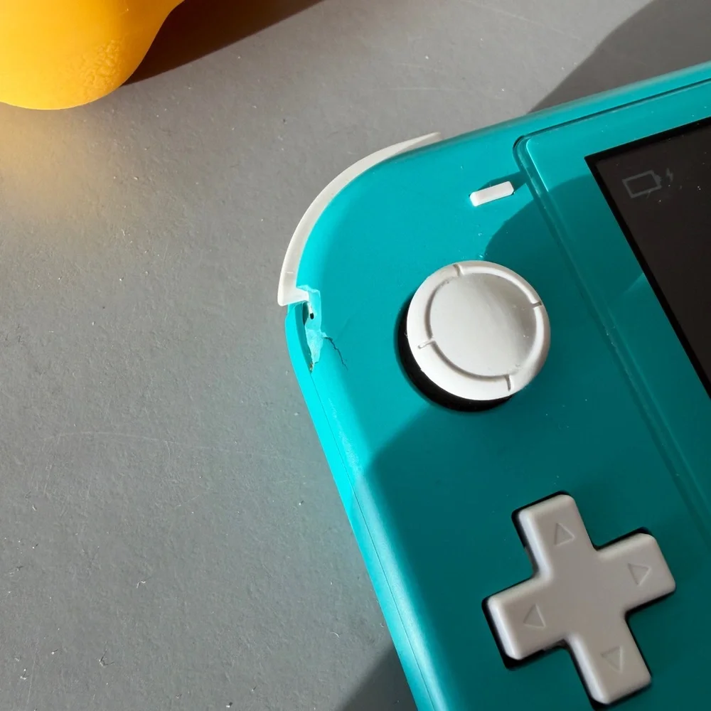 Teal Nintendo Switch Lite with Pokémon Sword